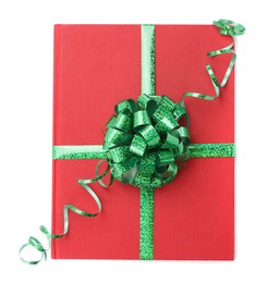 Photo of One book with green bow as gift isolated on white, top view