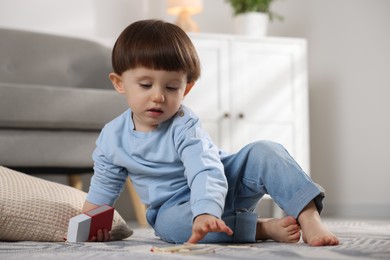 Little boy playing with matches at home. Child in danger