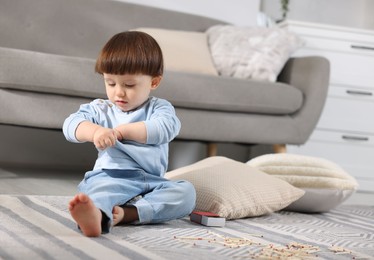 Little boy playing with matches at home. Child in danger