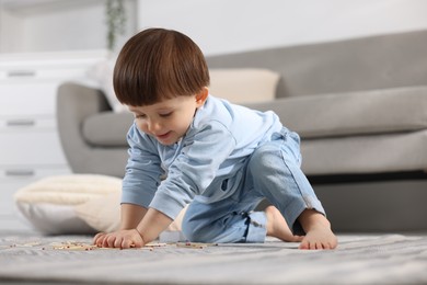 Photo of Little boy playing with matches at home. Child in danger