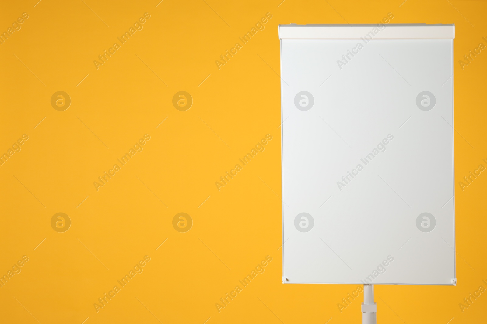 Photo of Flip chart on orange background. Mockup for design