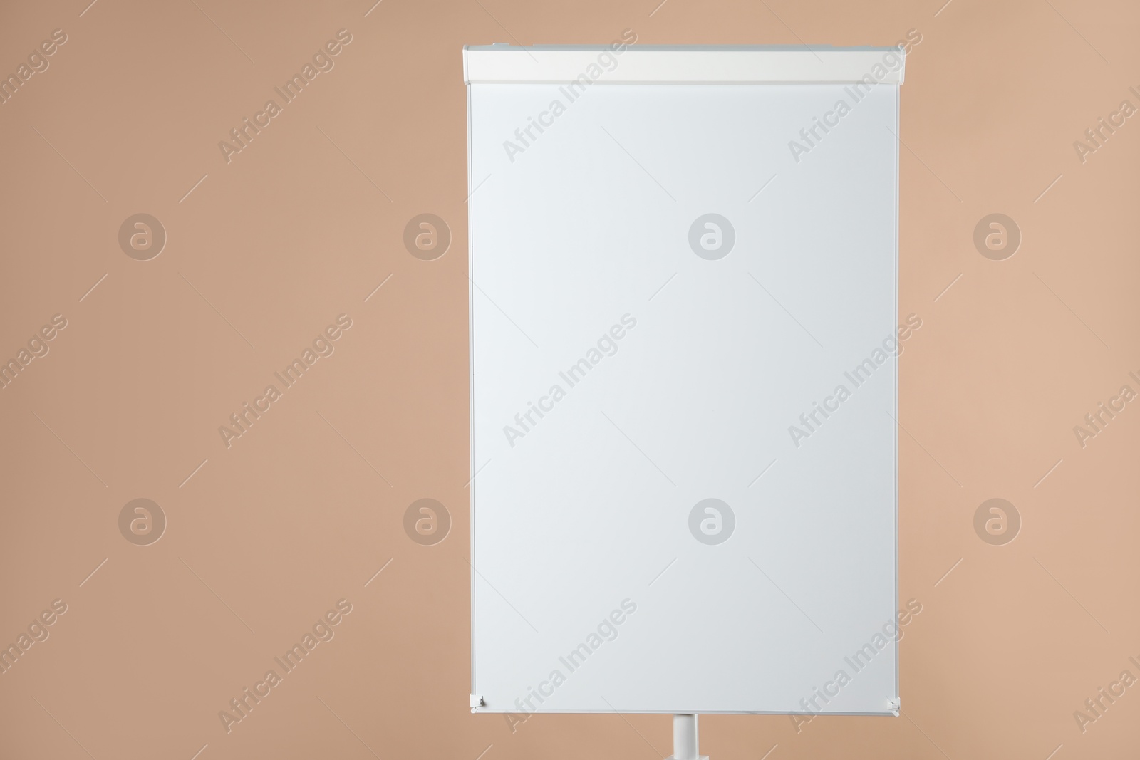 Photo of Flip chart on pale brown background. Mockup for design