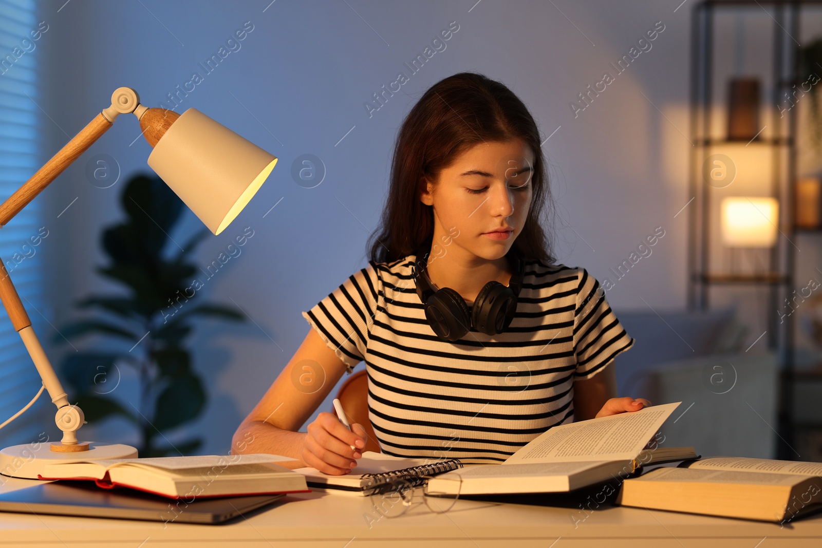 Photo of Student preparing for exam at table indoors