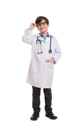 Photo of Boy with stethoscope pretending to be doctor on white background. Dreaming of future profession