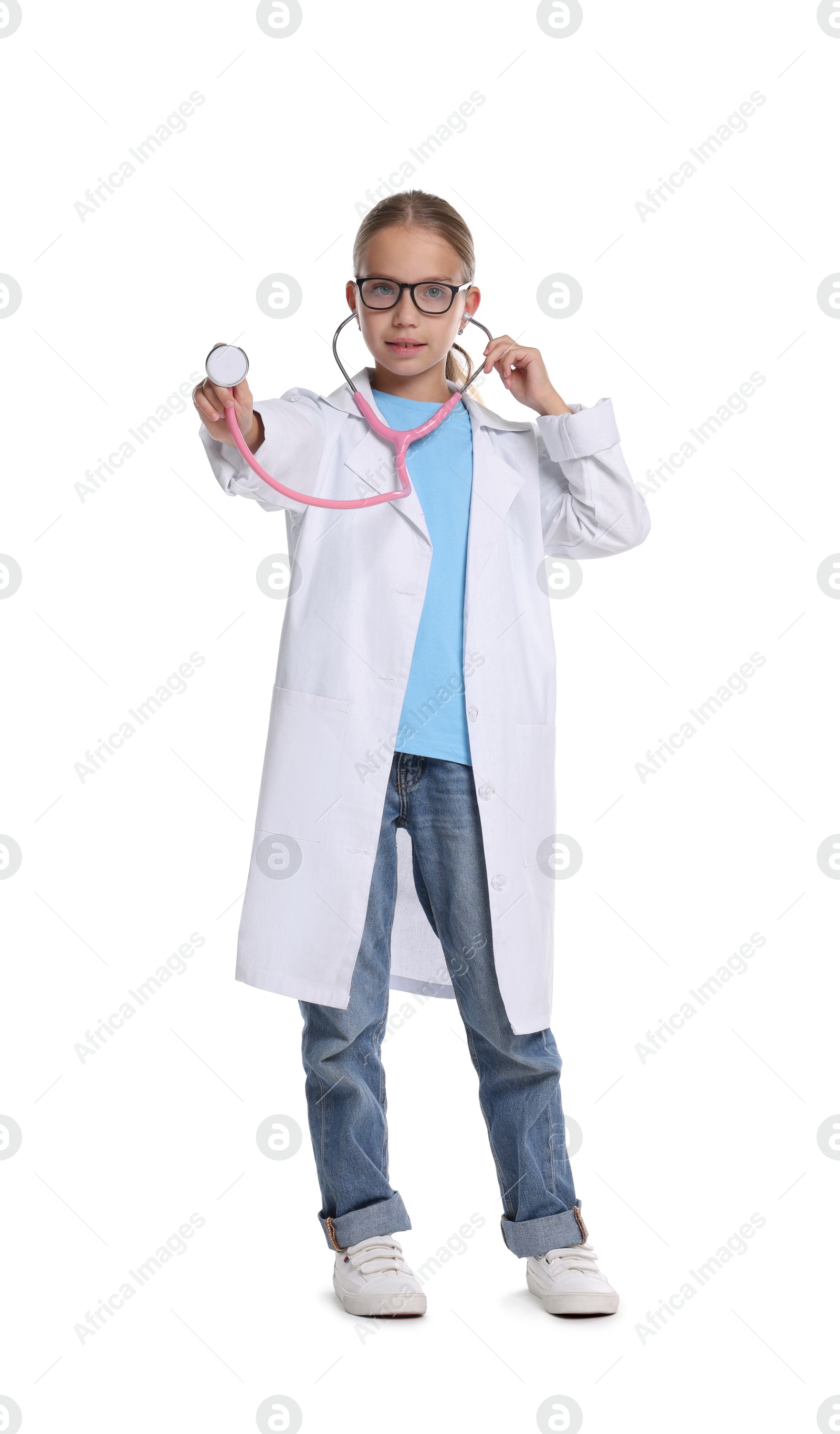 Photo of Girl with stethoscope pretending to be doctor on white background. Dreaming of future profession