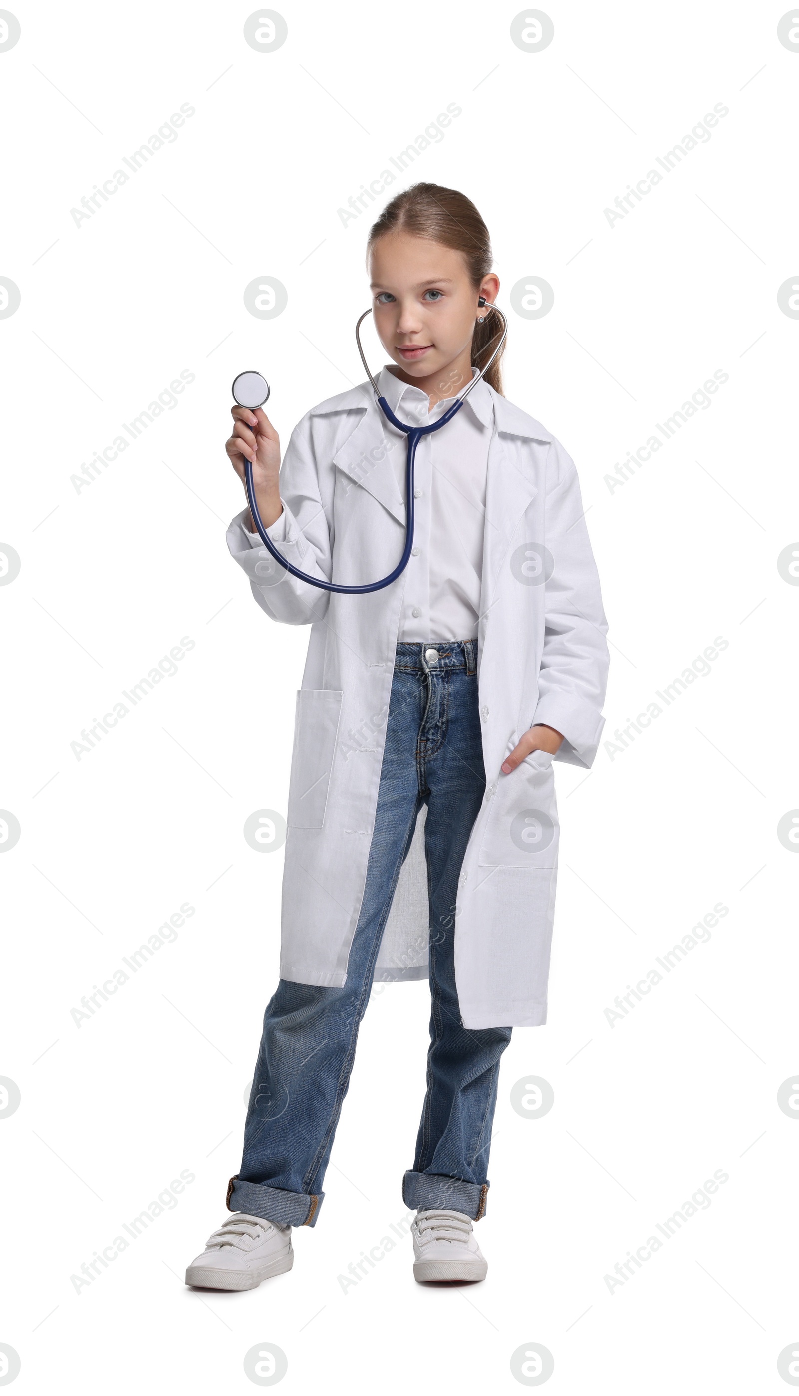 Photo of Girl with stethoscope pretending to be doctor on white background. Dreaming of future profession