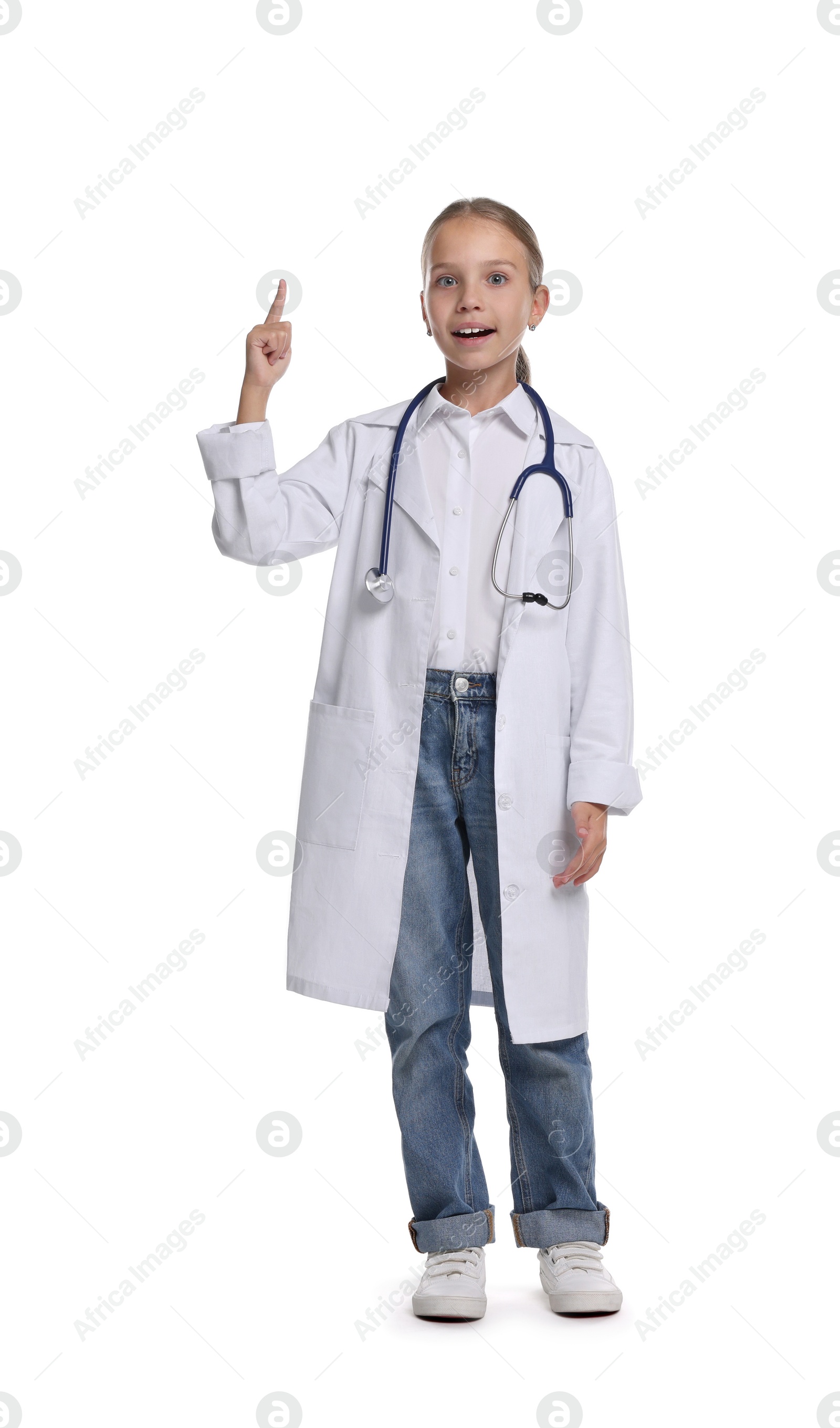 Photo of Girl with stethoscope pretending to be doctor on white background. Dreaming of future profession