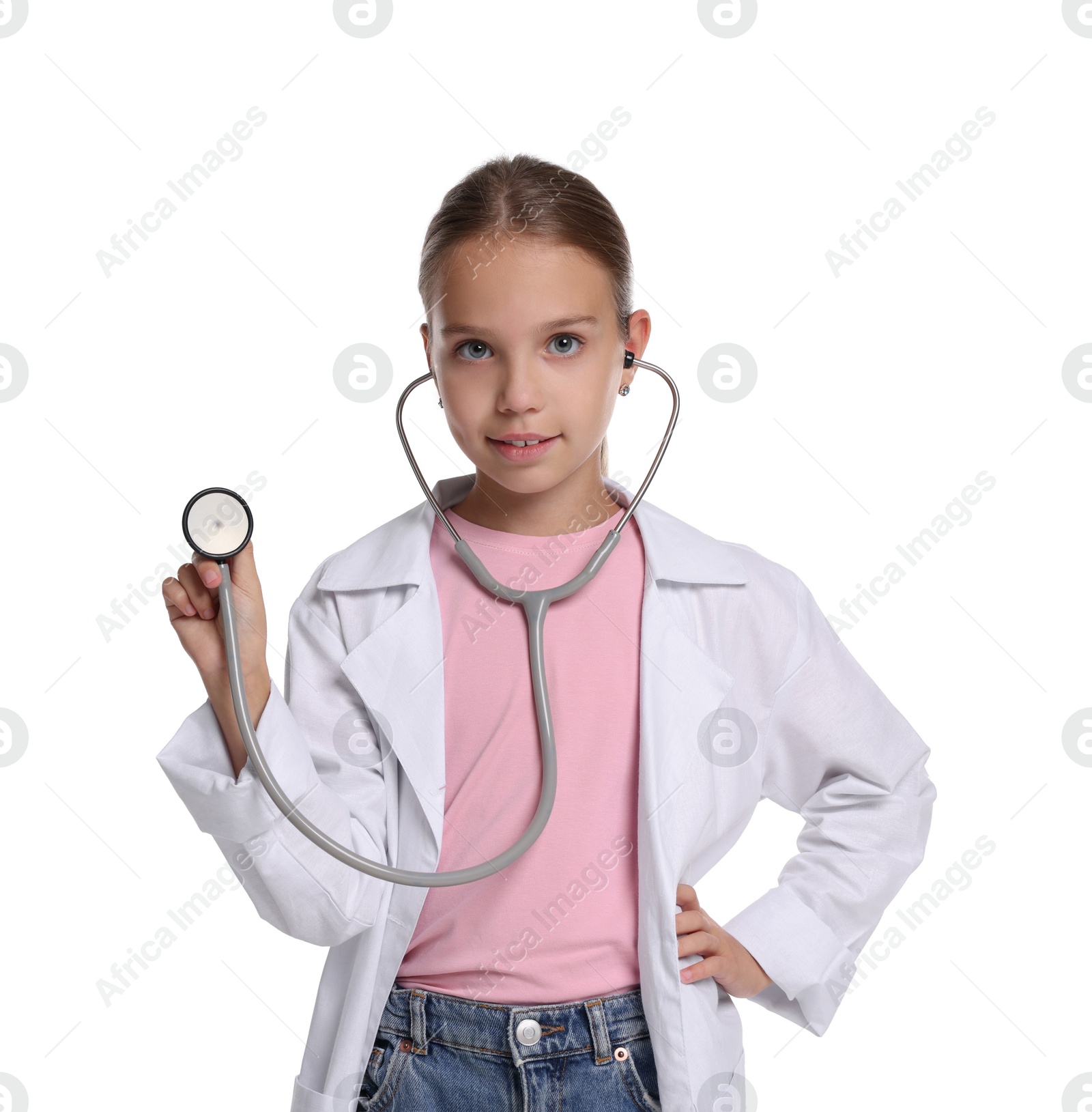 Photo of Girl with stethoscope pretending to be doctor on white background. Dreaming of future profession