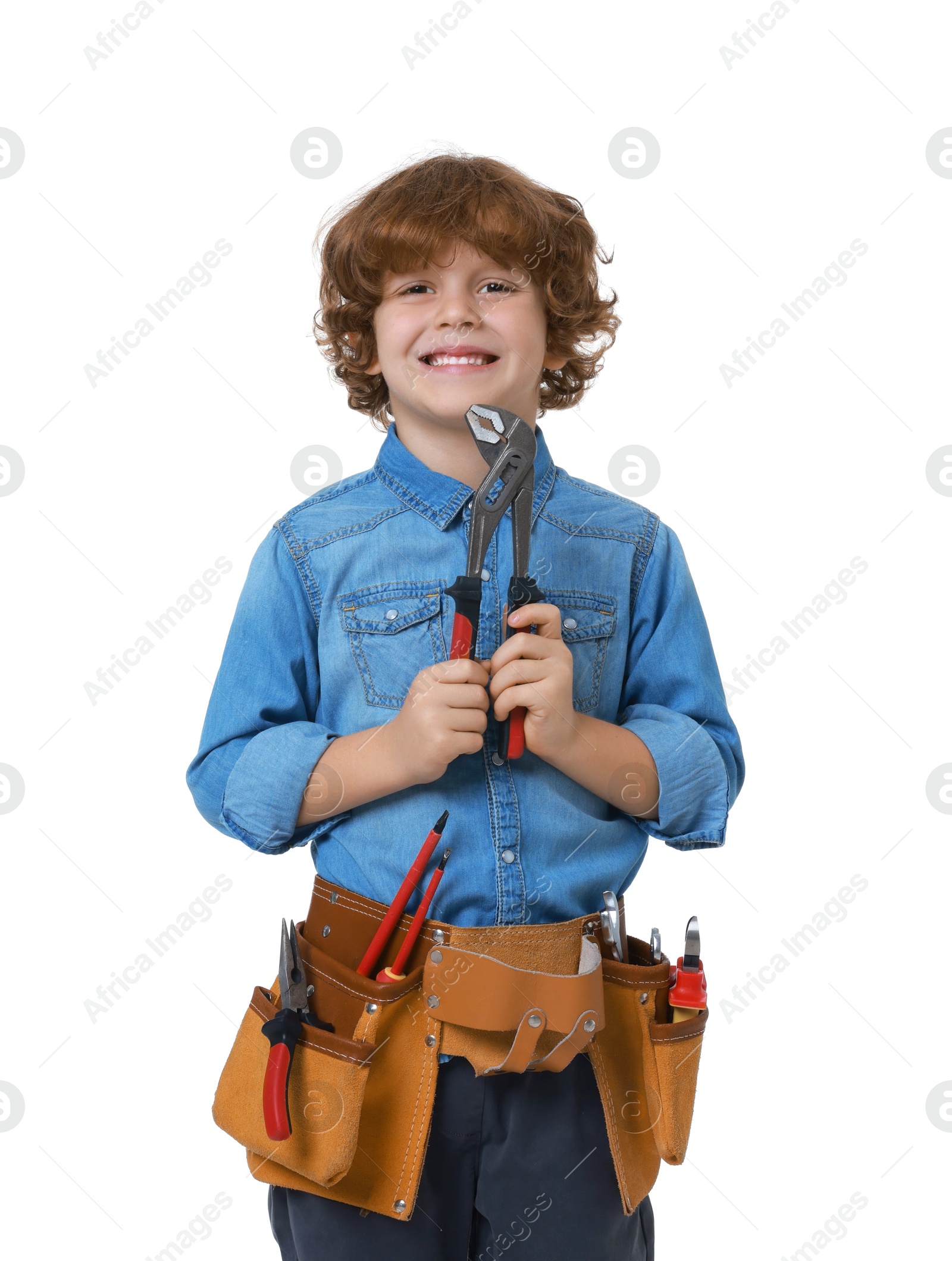 Photo of Little boy with tool belt and adjustable pliers on white background. Dreaming about future profession