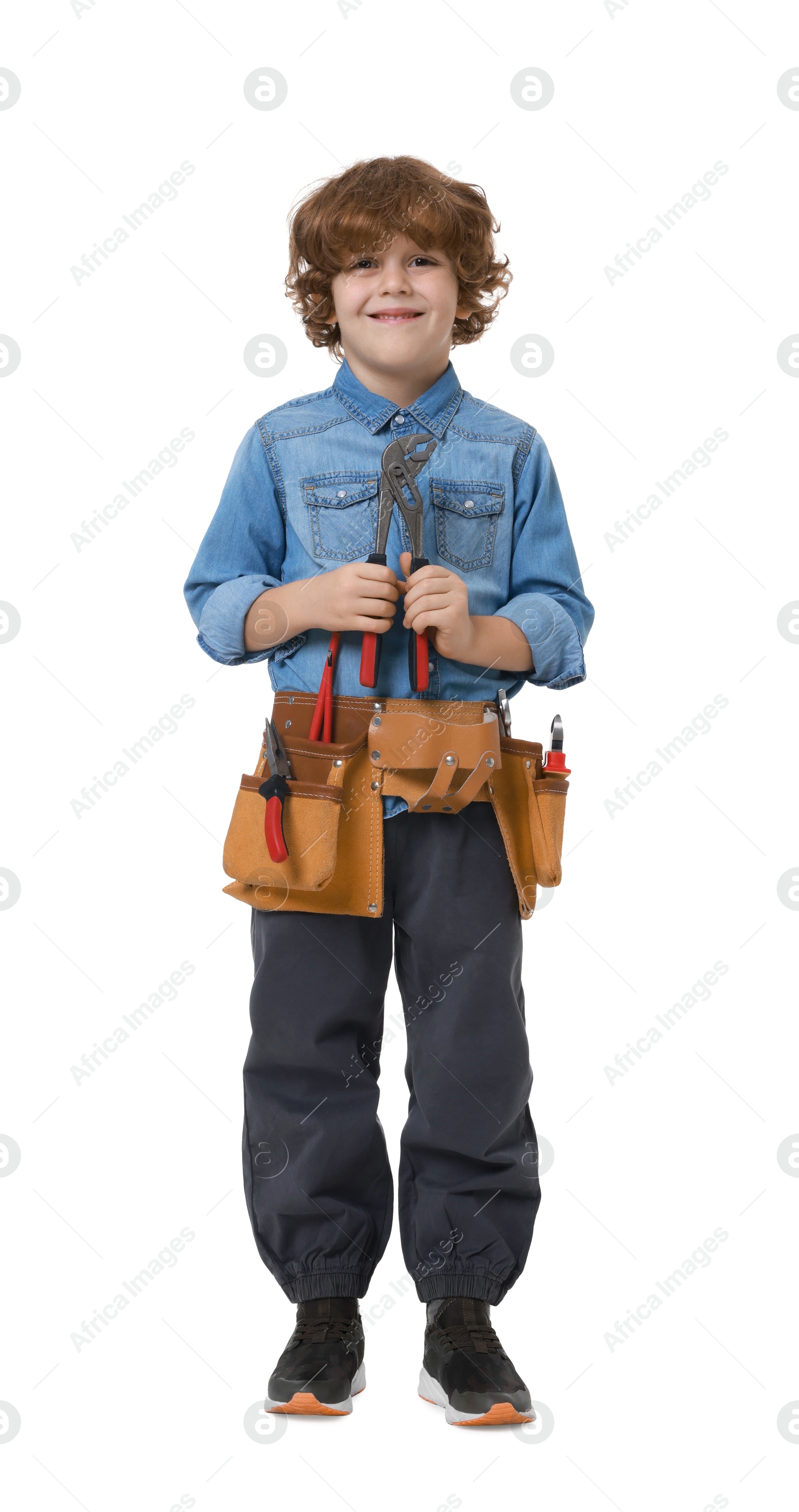 Photo of Little boy with tool belt and adjustable pliers on white background. Dreaming about future profession