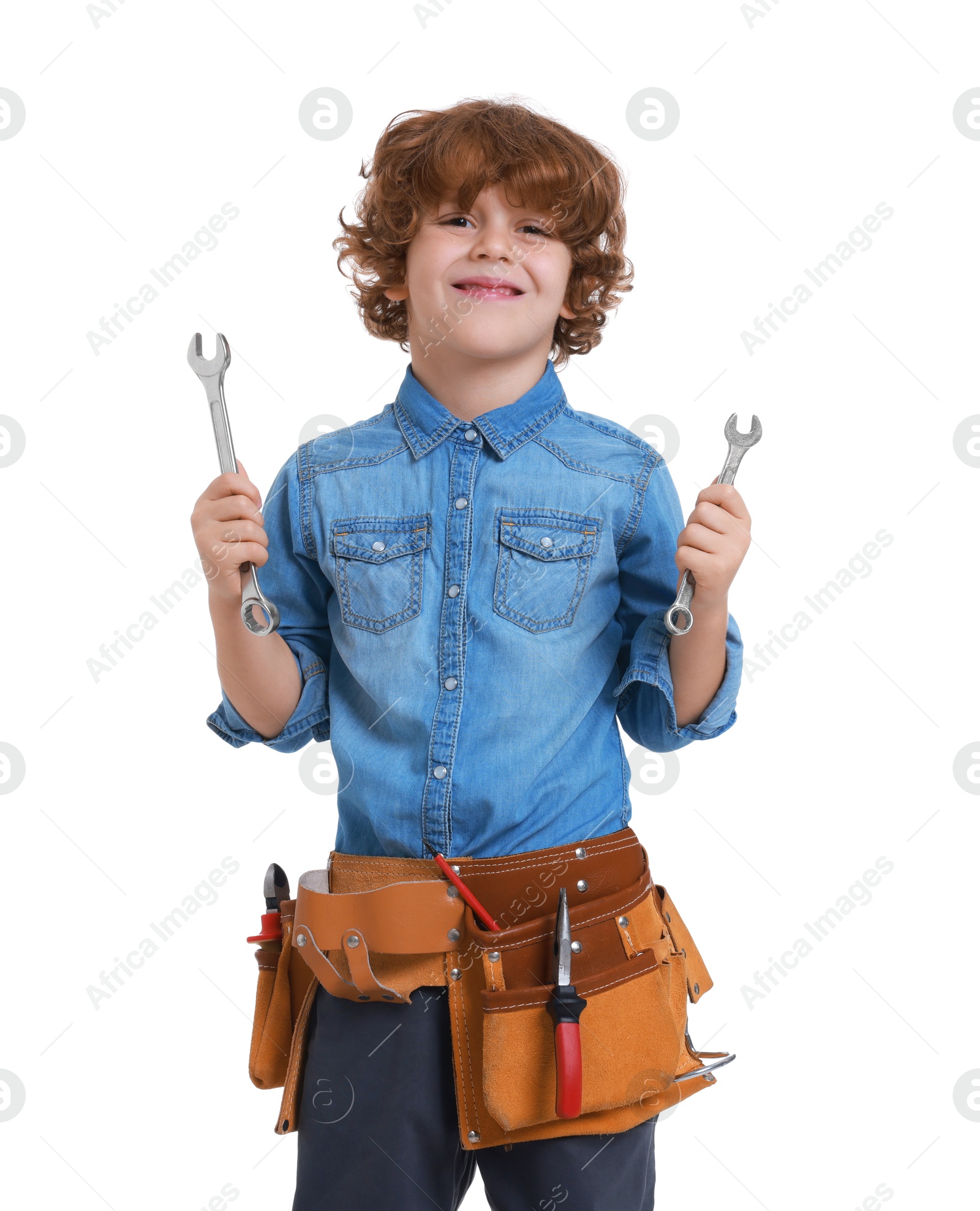 Photo of Little boy with tool belt and wrenches on white background. Dreaming about future profession