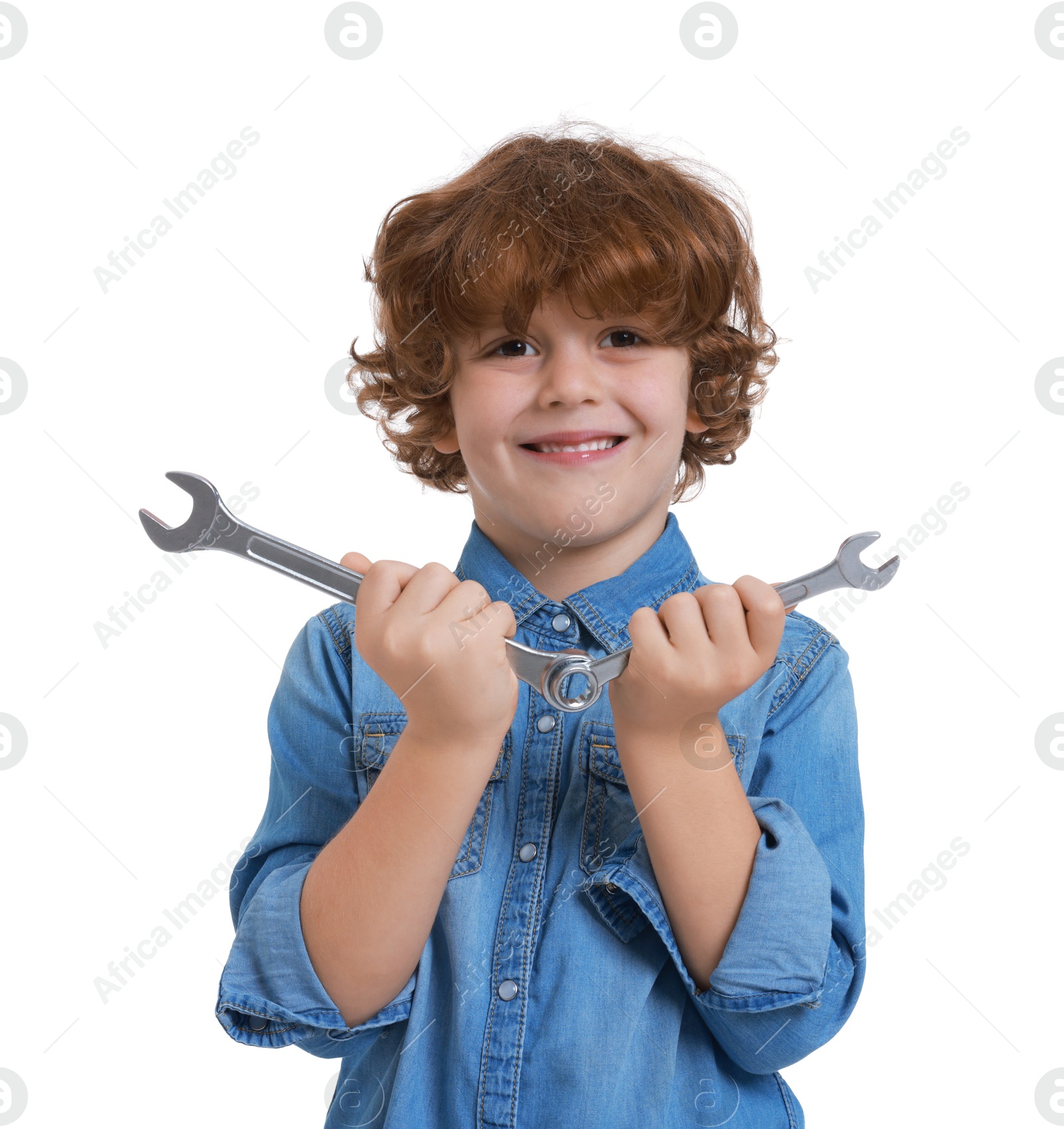 Photo of Little boy with wrenches on white background. Dreaming about future profession