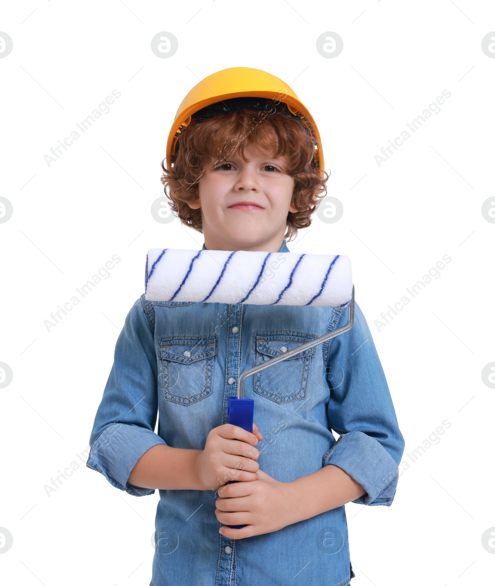 Photo of Little boy in hard hat with roller brush on white background. Dreaming about future profession