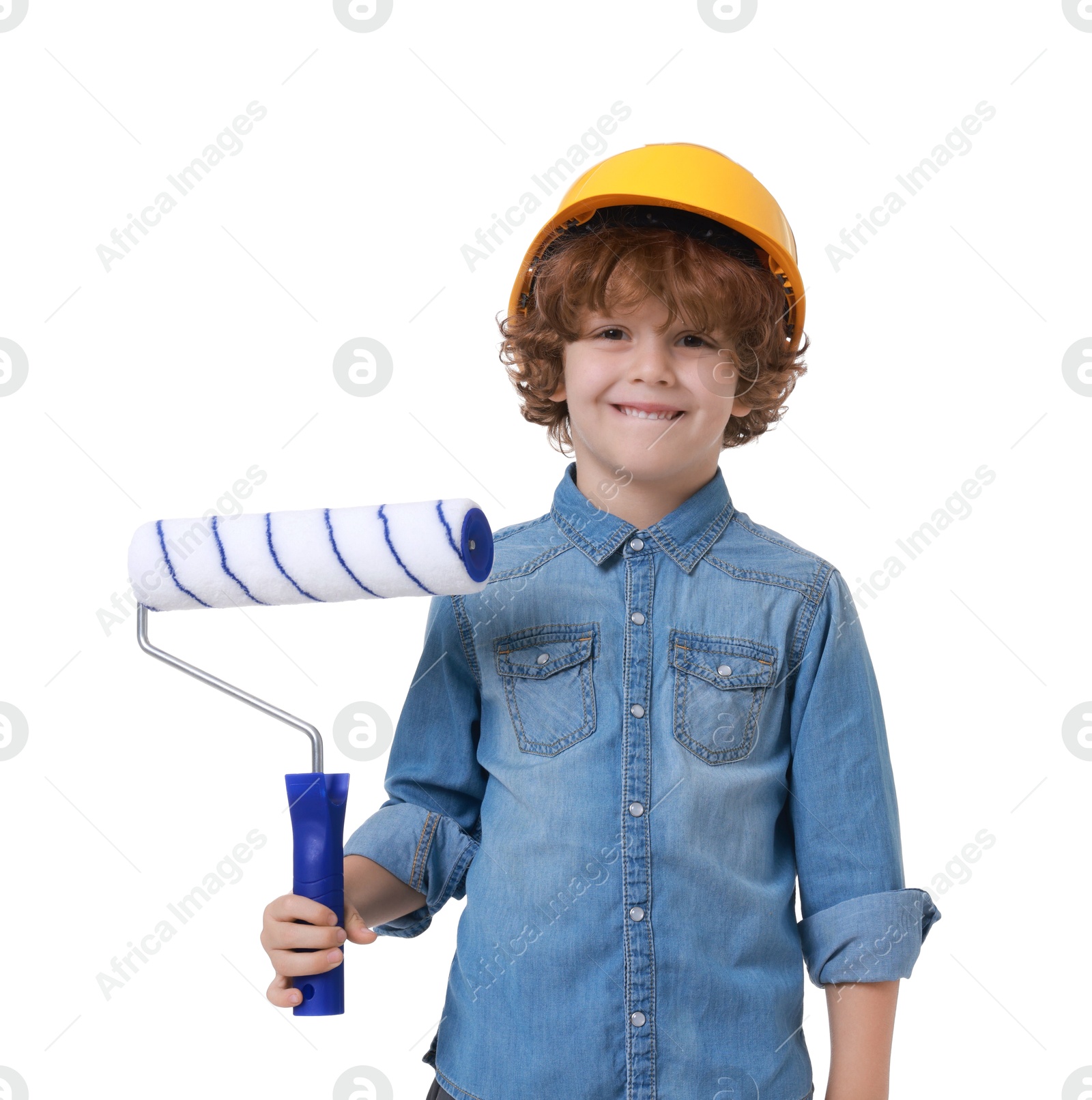 Photo of Little boy in hard hat with roller brush on white background. Dreaming about future profession