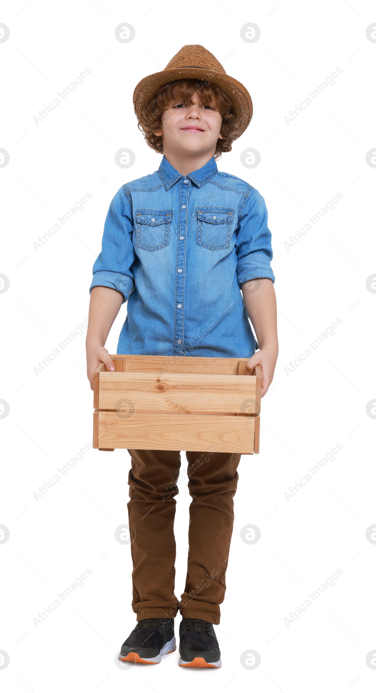 Photo of Little boy with wooden crate pretending to be farmer on white background. Dreaming about future profession