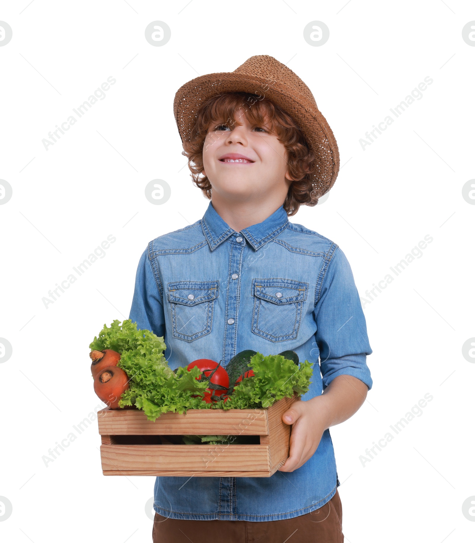 Photo of Little boy with vegetables pretending to be farmer on white background. Dreaming about future profession