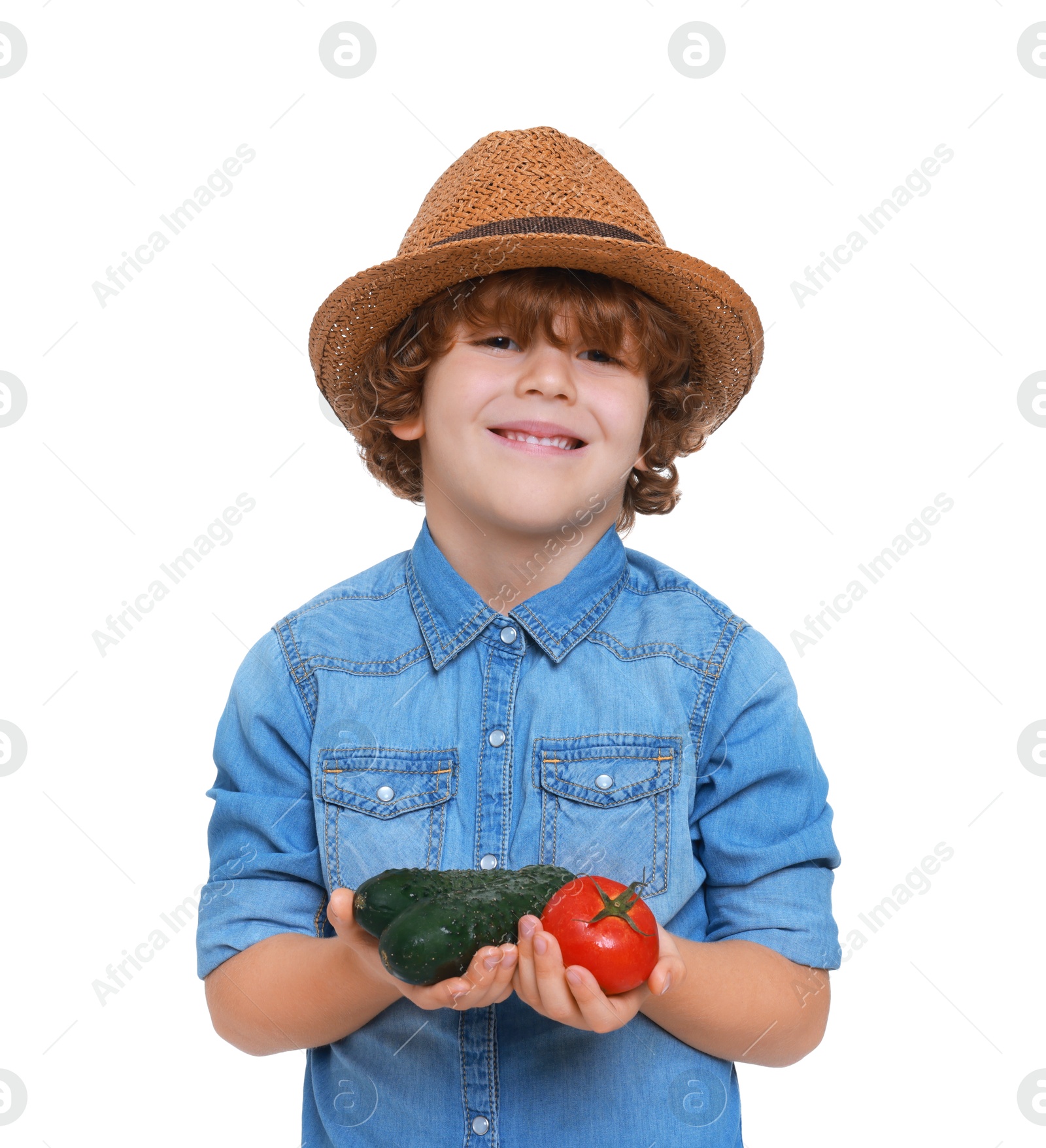 Photo of Little boy with vegetables pretending to be farmer on white background. Dreaming about future profession