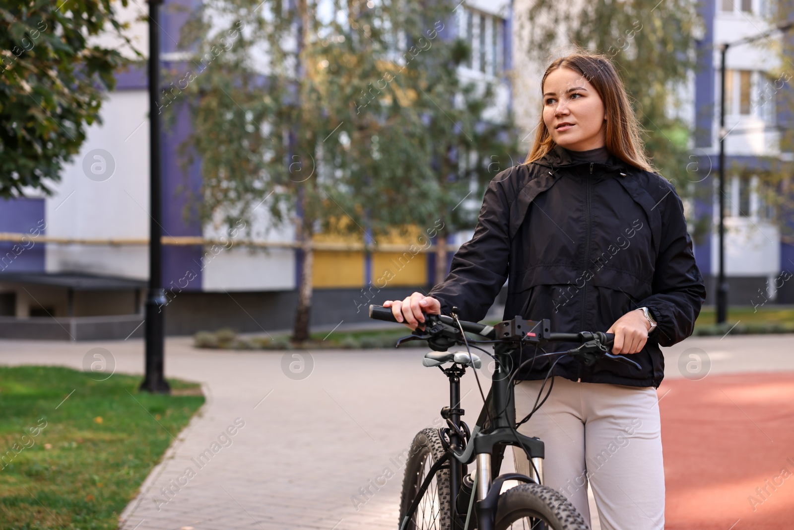 Photo of Woman with bicycle outdoors, space for text. Healthy lifestyle