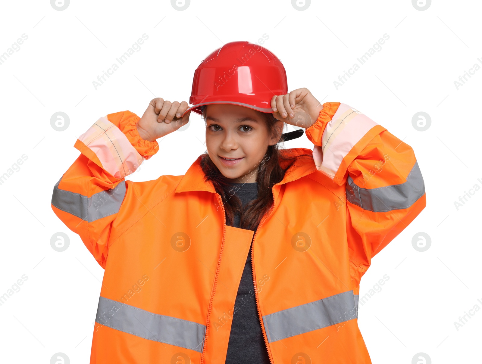 Photo of Girl with hardhat and vest pretending to be firefighter on white background. Dreaming of future profession