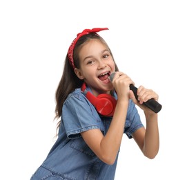 Photo of Girl with headphones and microphone pretending to be singer on white background. Dreaming of future profession