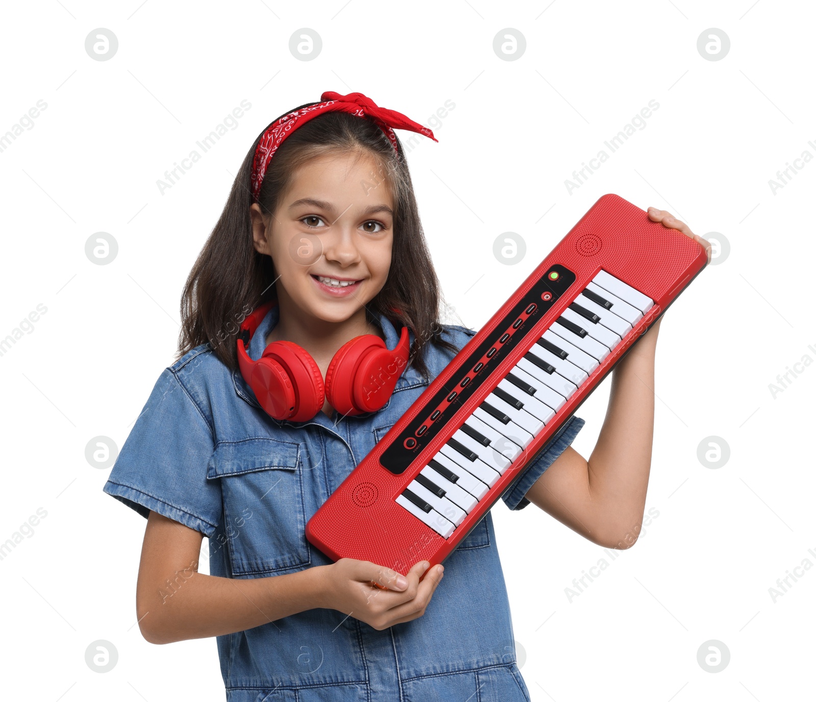 Photo of Girl with headphones and electric piano pretending to be musician on white background. Dreaming of future profession