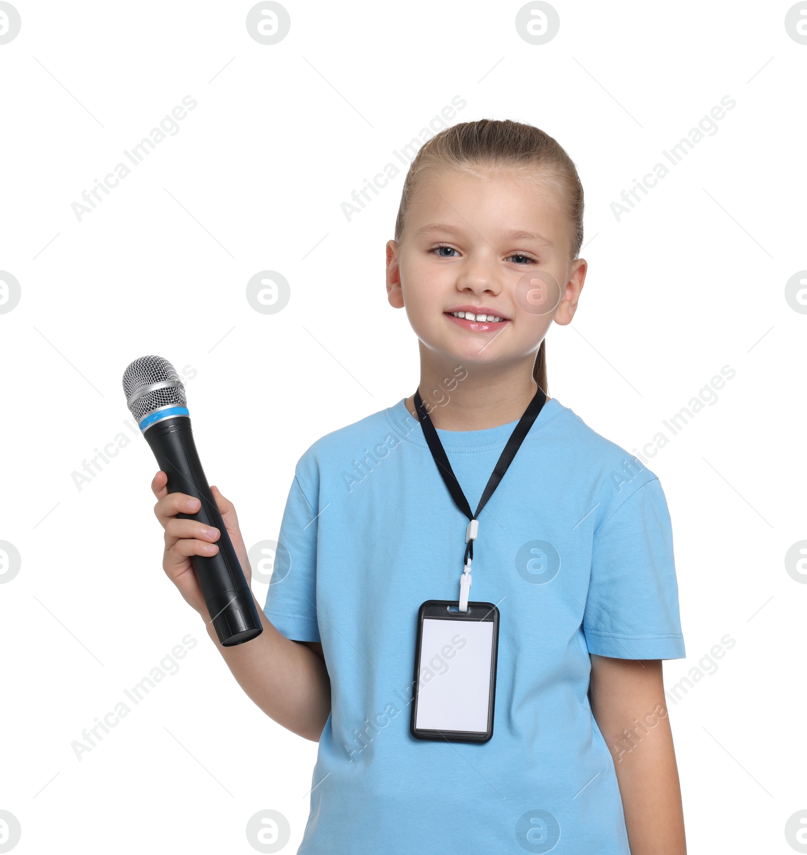 Photo of Little girl with microphone pretending to be journalist on white background. Dreaming of future profession