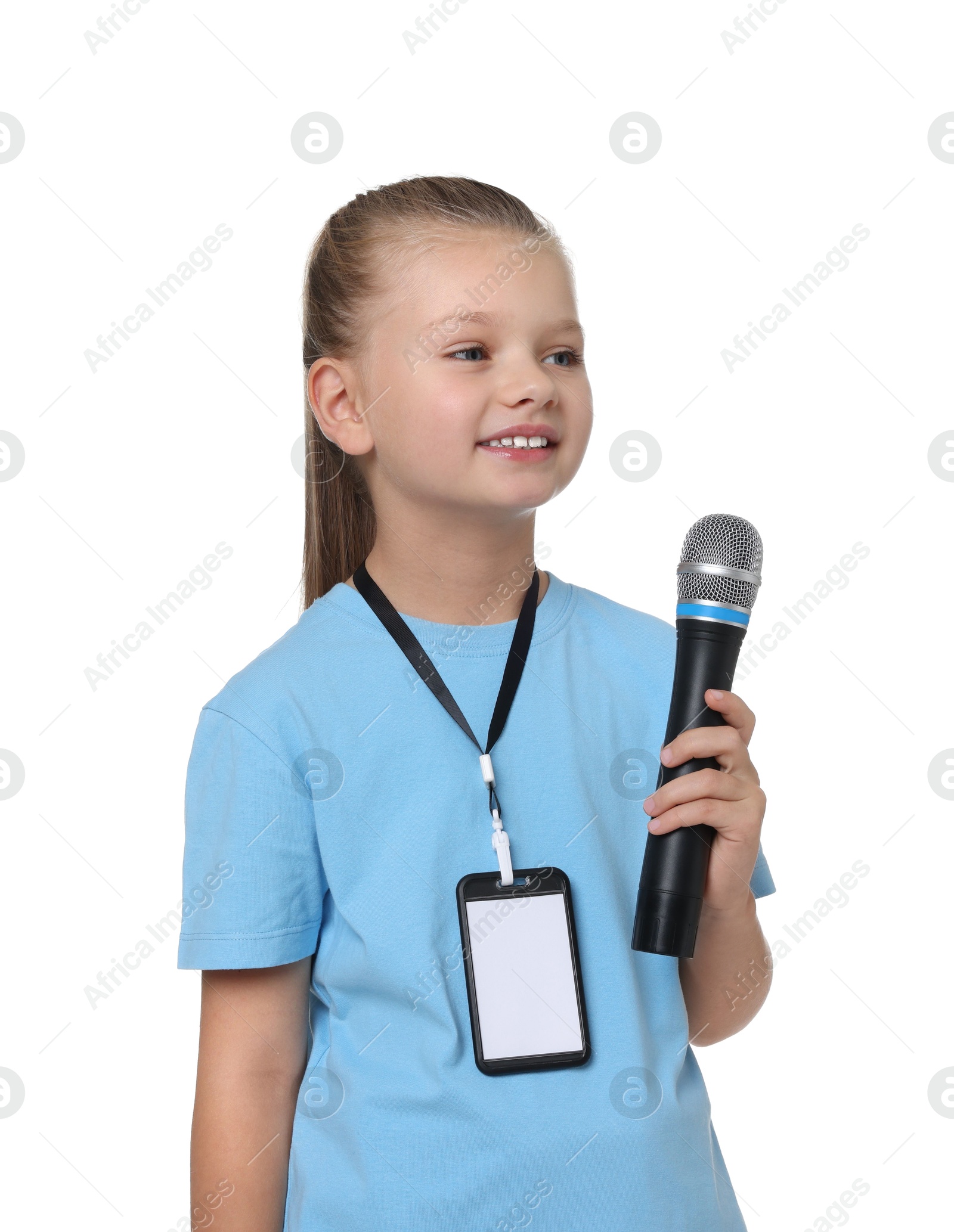 Photo of Little girl with microphone pretending to be journalist on white background. Dreaming of future profession