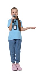 Photo of Little girl with microphone pretending to be journalist on white background. Dreaming of future profession