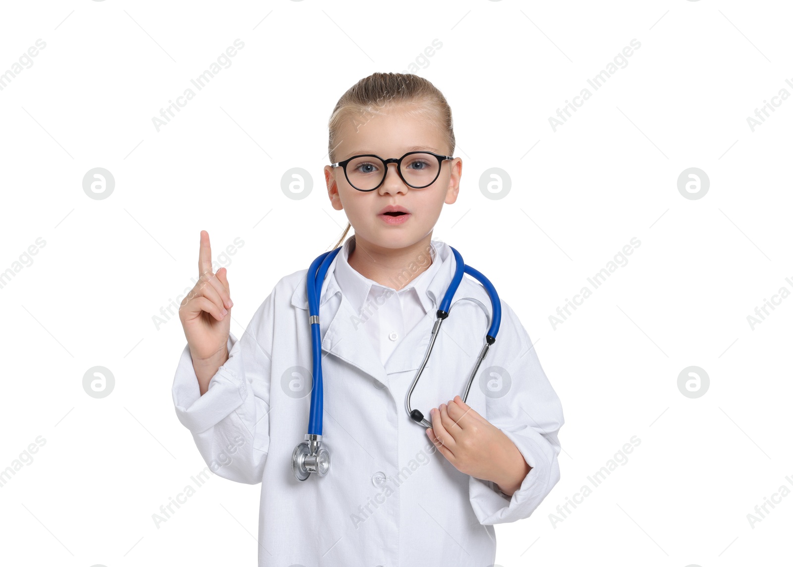 Photo of Little girl with stethoscope pretending to be doctor on white background. Dreaming of future profession