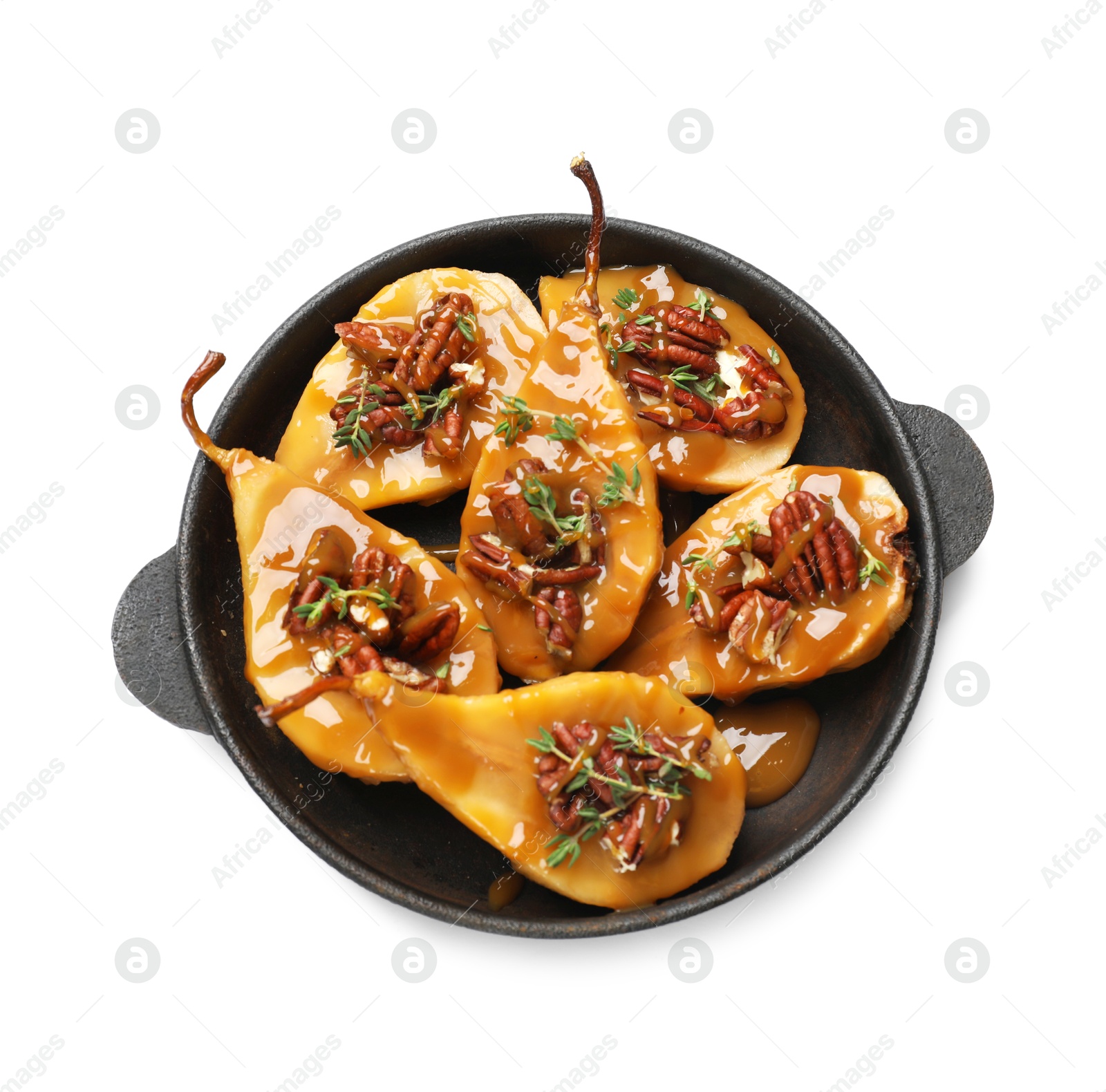 Photo of Delicious pears with caramel sauce, pecan nuts and thyme isolated on white, top view