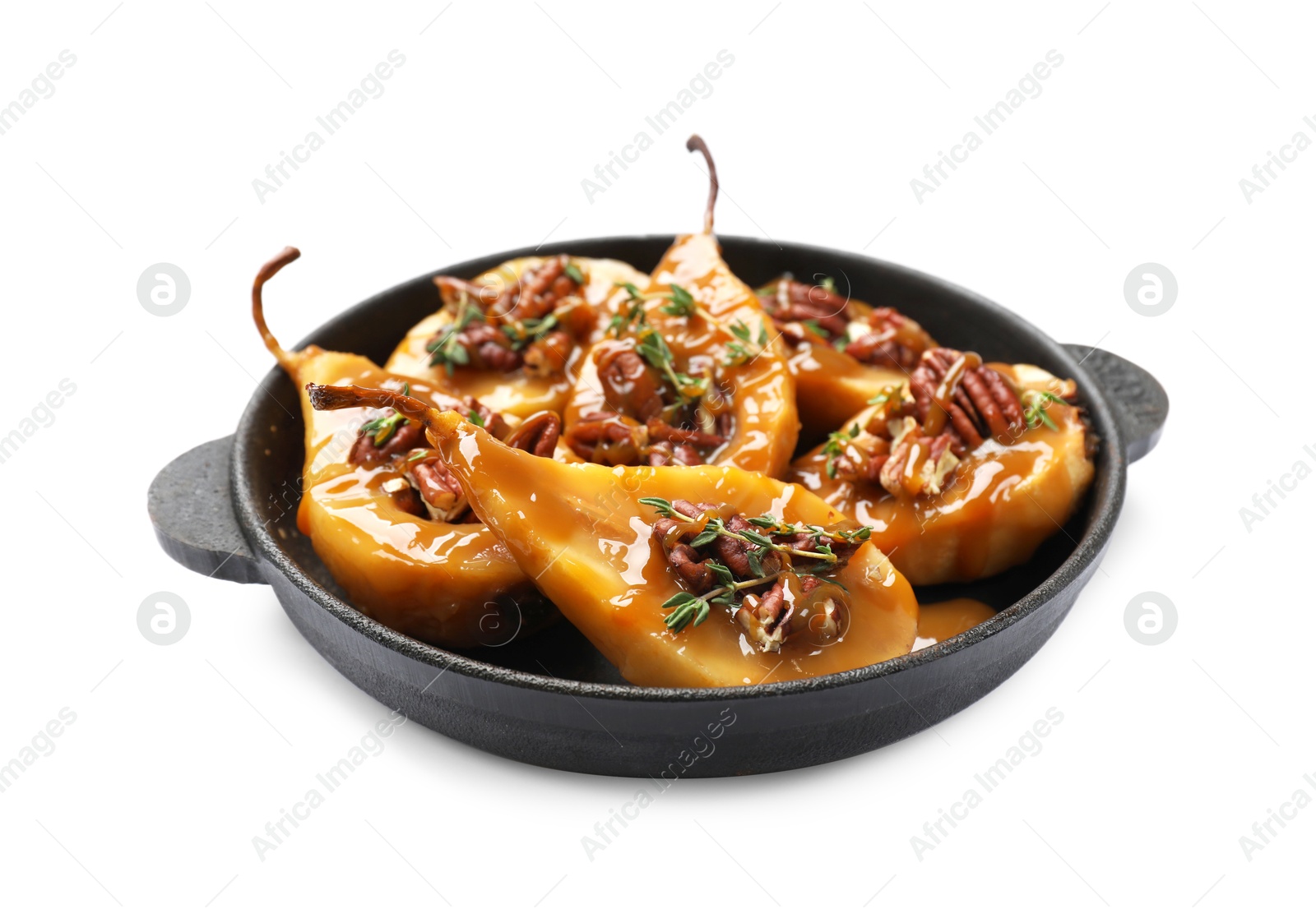 Photo of Delicious pears with caramel sauce, pecan nuts and thyme isolated on white