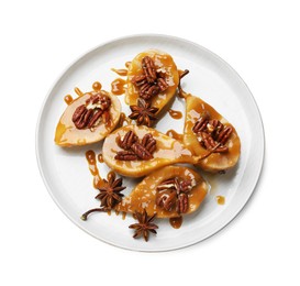 Photo of Delicious pears with caramel sauce, pecan nuts and anise stars isolated on white, top view