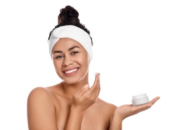 Photo of Beautiful young woman with jar of cream on white background