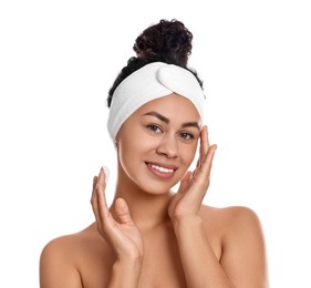 Photo of Beautiful woman applying cream onto face against white background