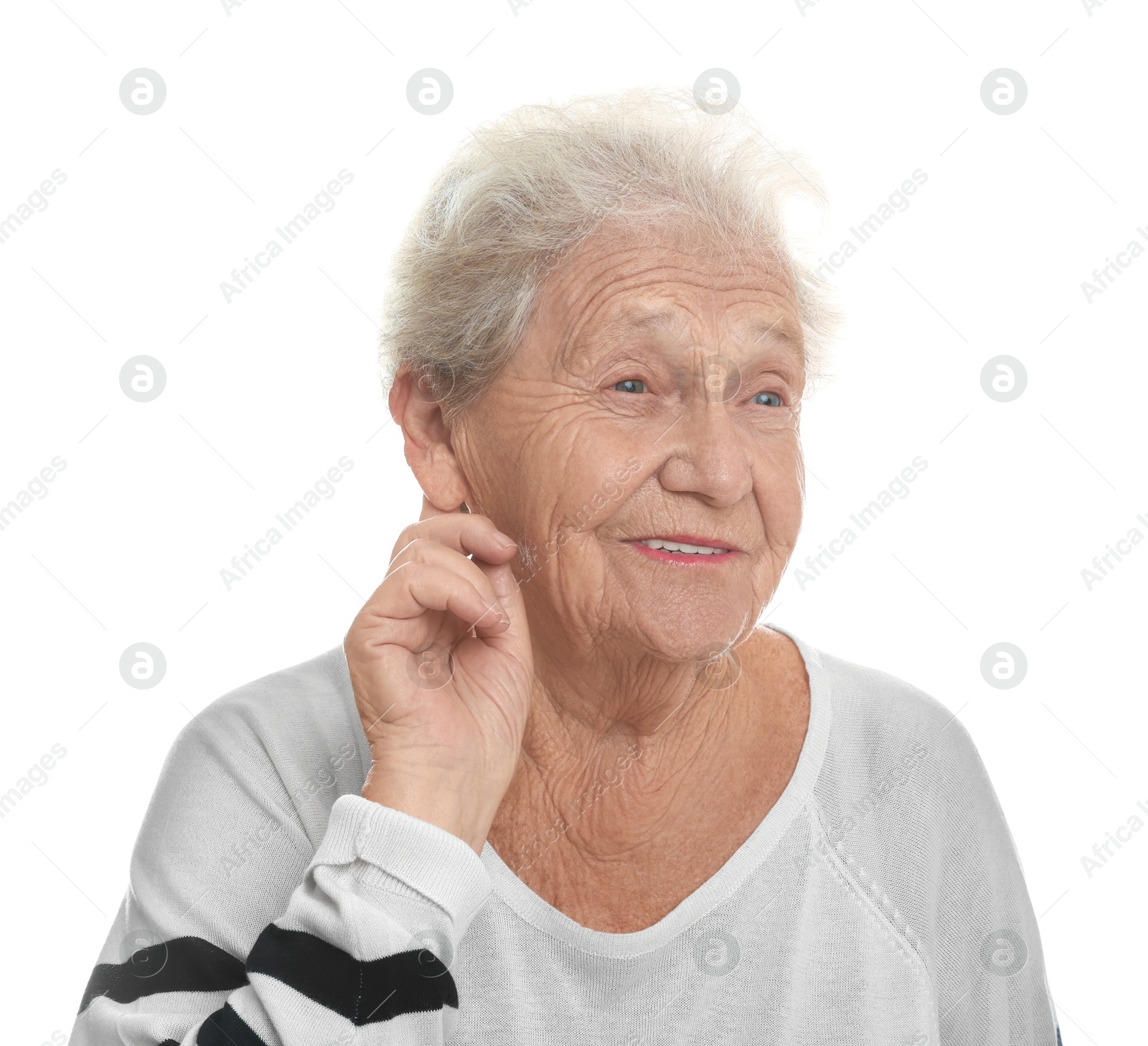 Photo of Senior woman showing hand to ear gesture on white background