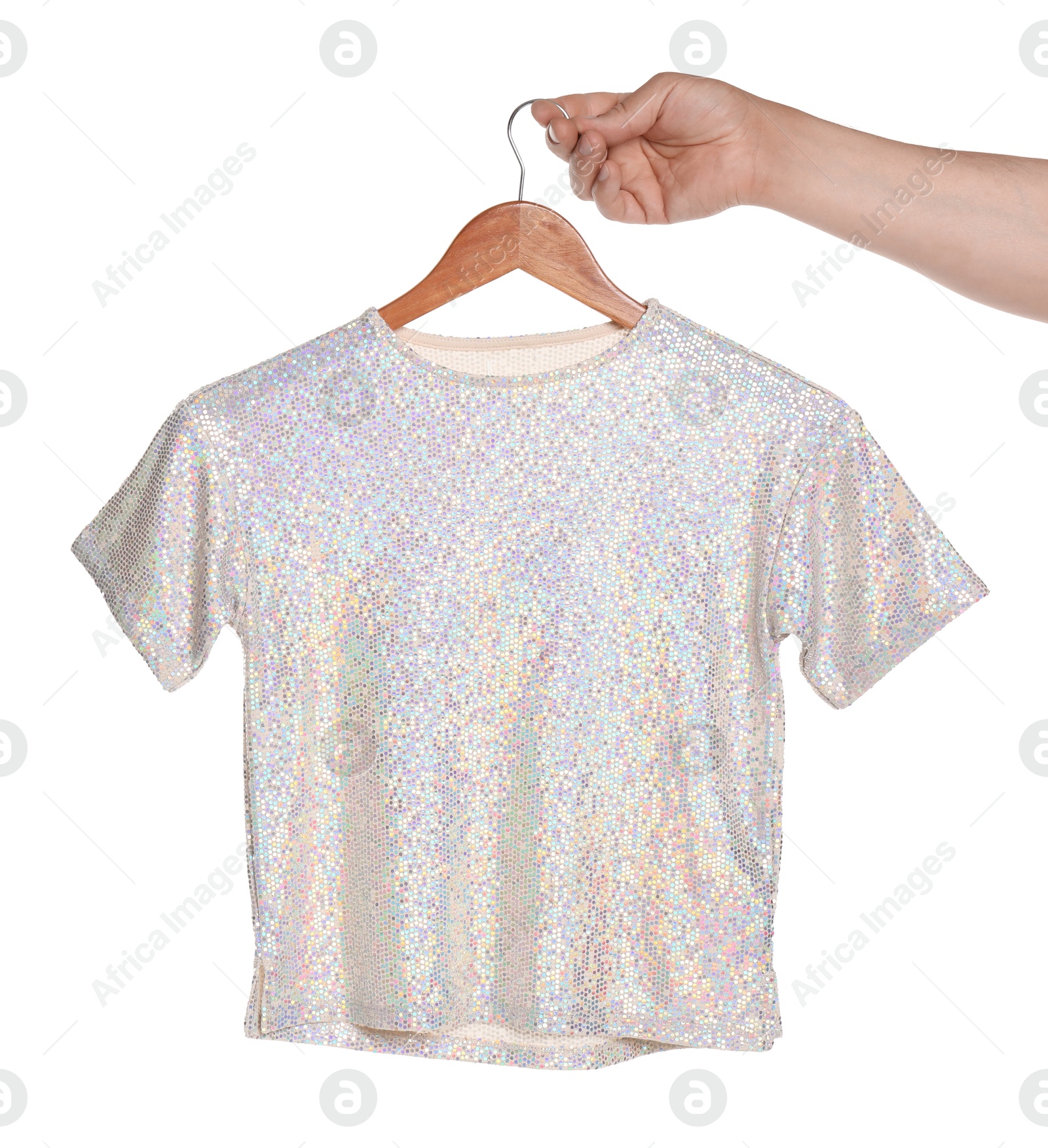 Photo of Woman holding hanger with t-shirt on white background, closeup