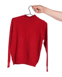 Photo of Woman holding hanger with red long sleeve on white background, closeup