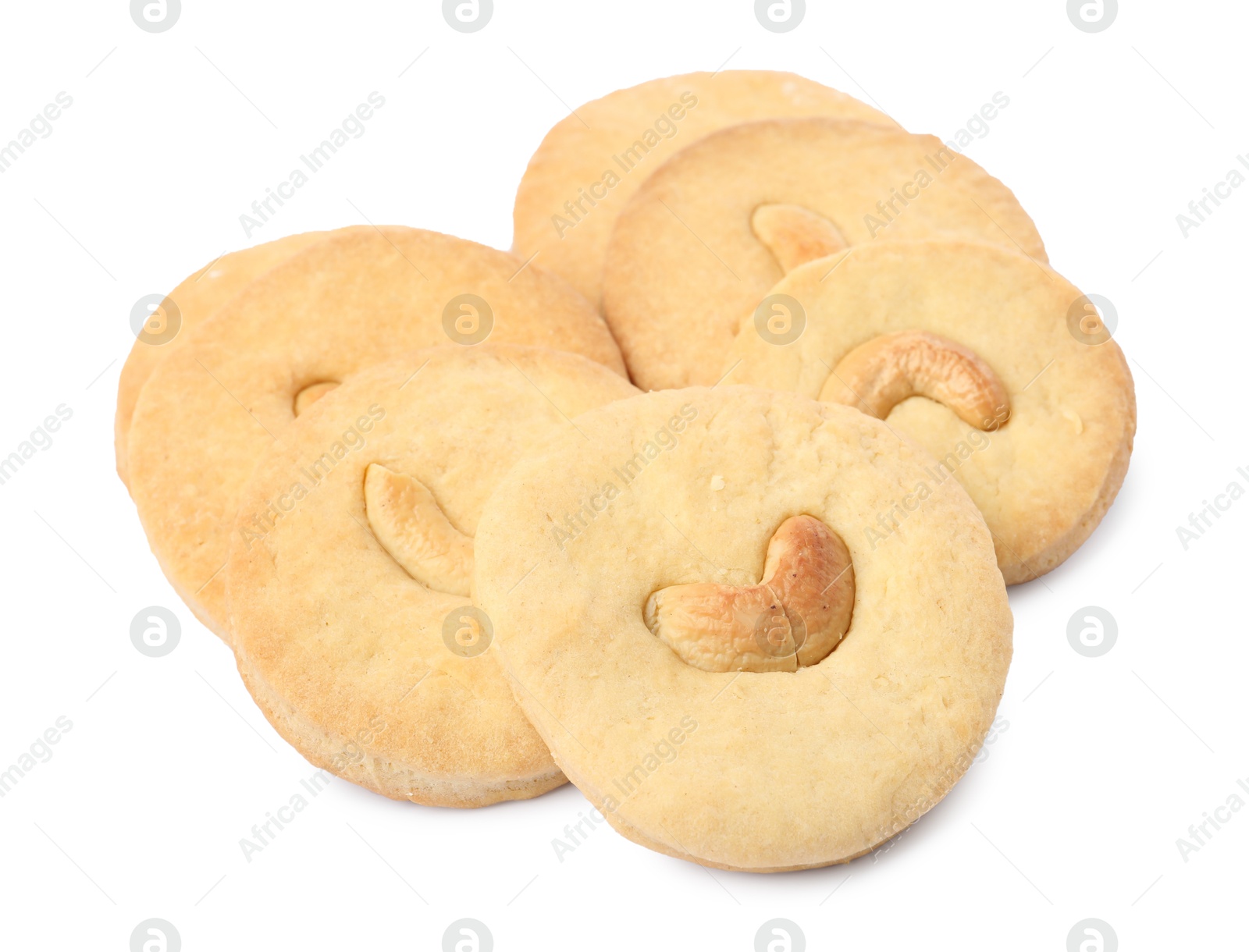 Photo of Many tasty cashew cookies isolated on white