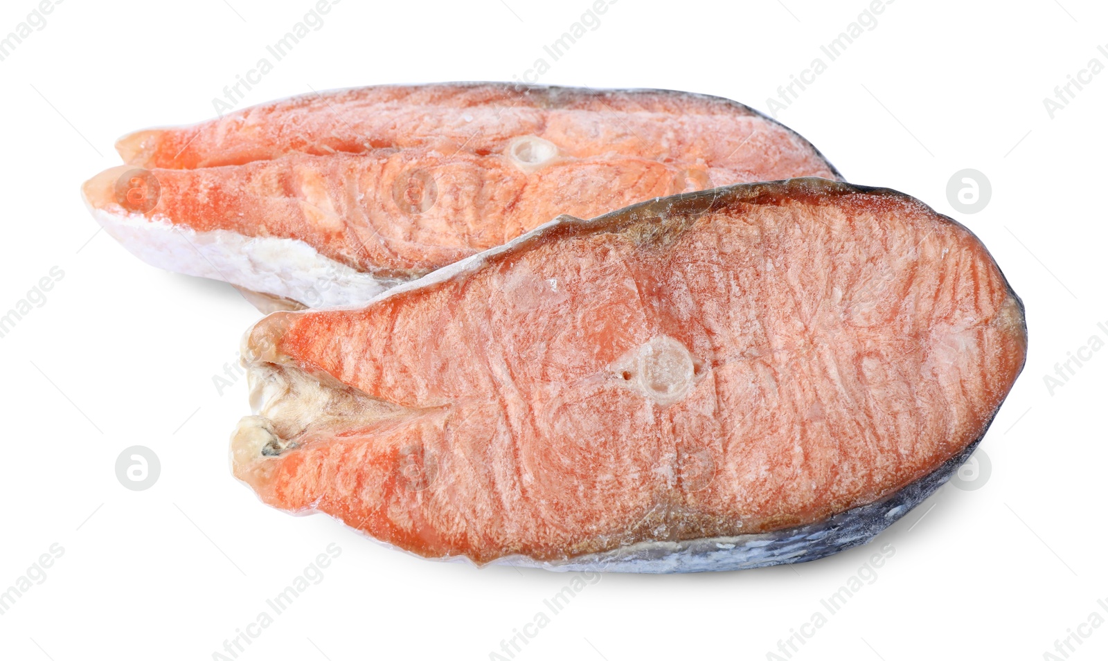 Photo of Two frozen salmon steaks isolated on white