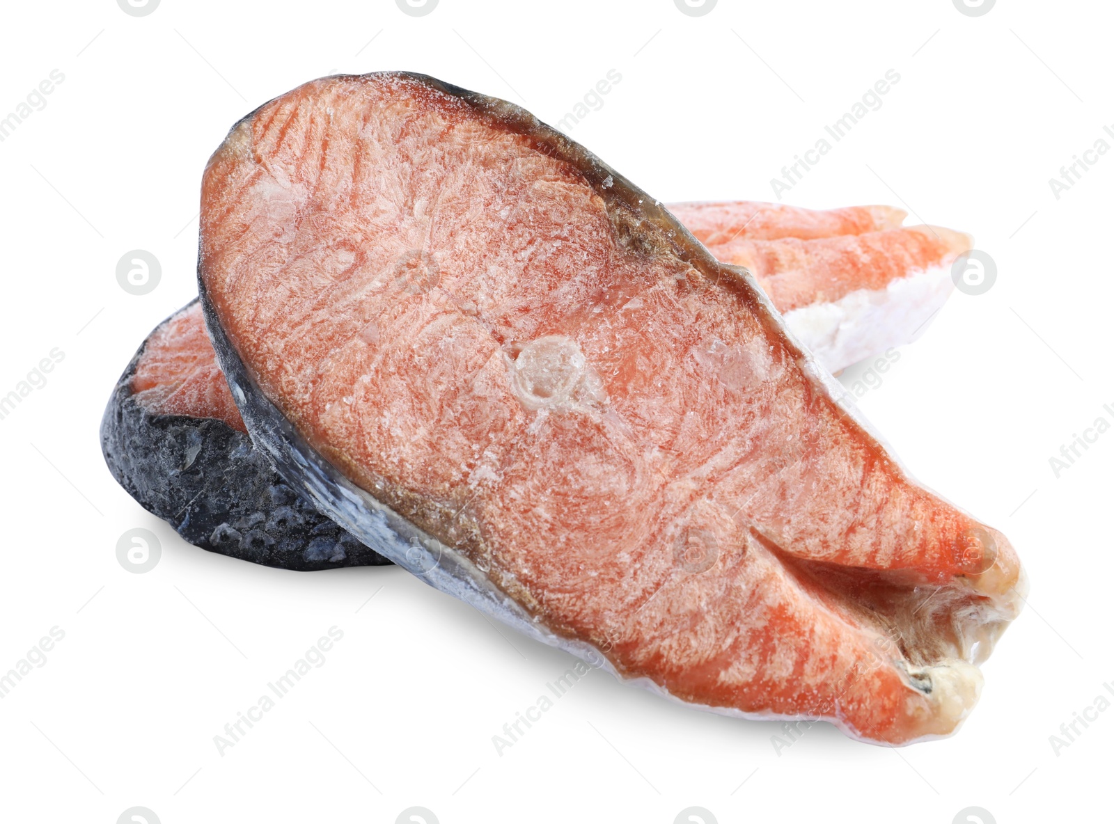 Photo of Two frozen salmon steaks isolated on white