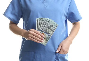 Photo of Corruption concept. Doctor with dollar banknotes on white background, closeup