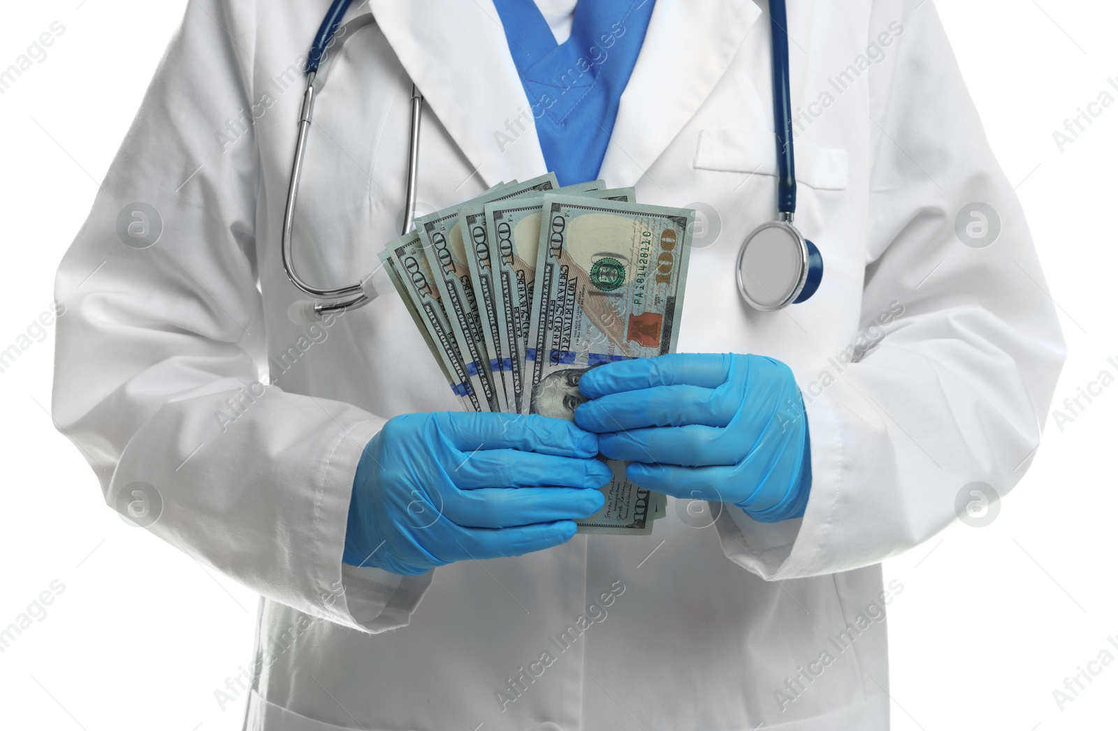 Photo of Corruption concept. Doctor with dollar banknotes on white background, closeup