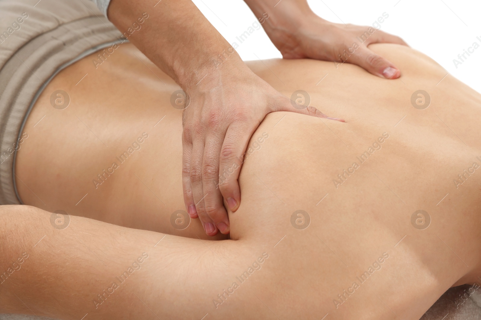 Photo of Massage therapist working with patient in clinic, closeup