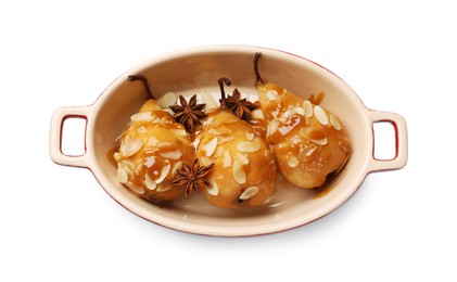 Photo of Delicious pears with caramel sauce, almond flakes and anise stars isolated on white, top view