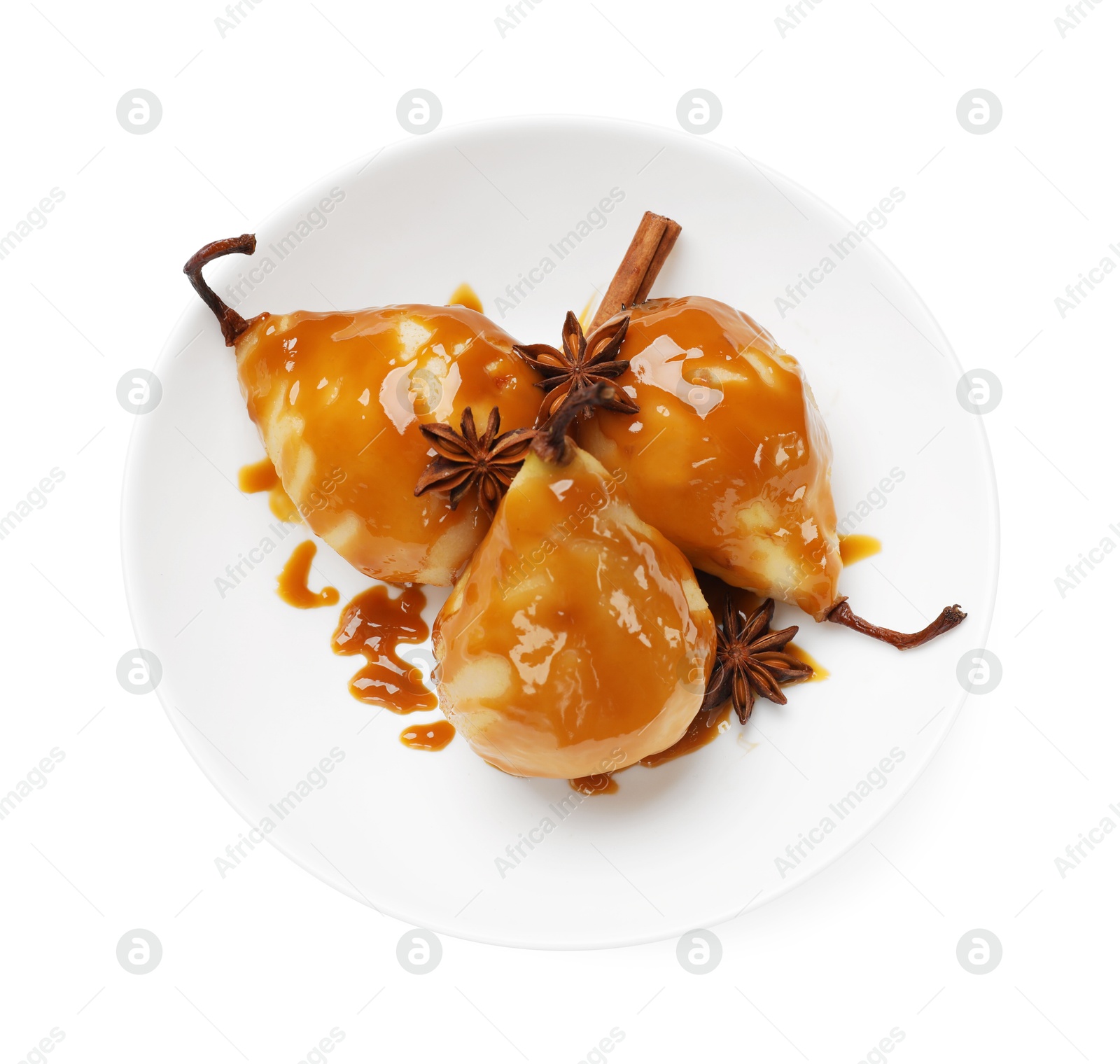 Photo of Delicious pears with caramel sauce and spices isolated on white, top view