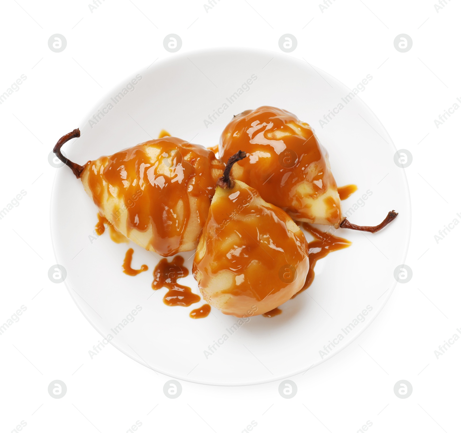 Photo of Delicious pears with caramel sauce isolated on white, top view