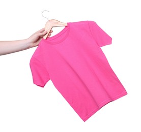 Photo of Woman holding hanger with pink t-shirt on white background, closeup