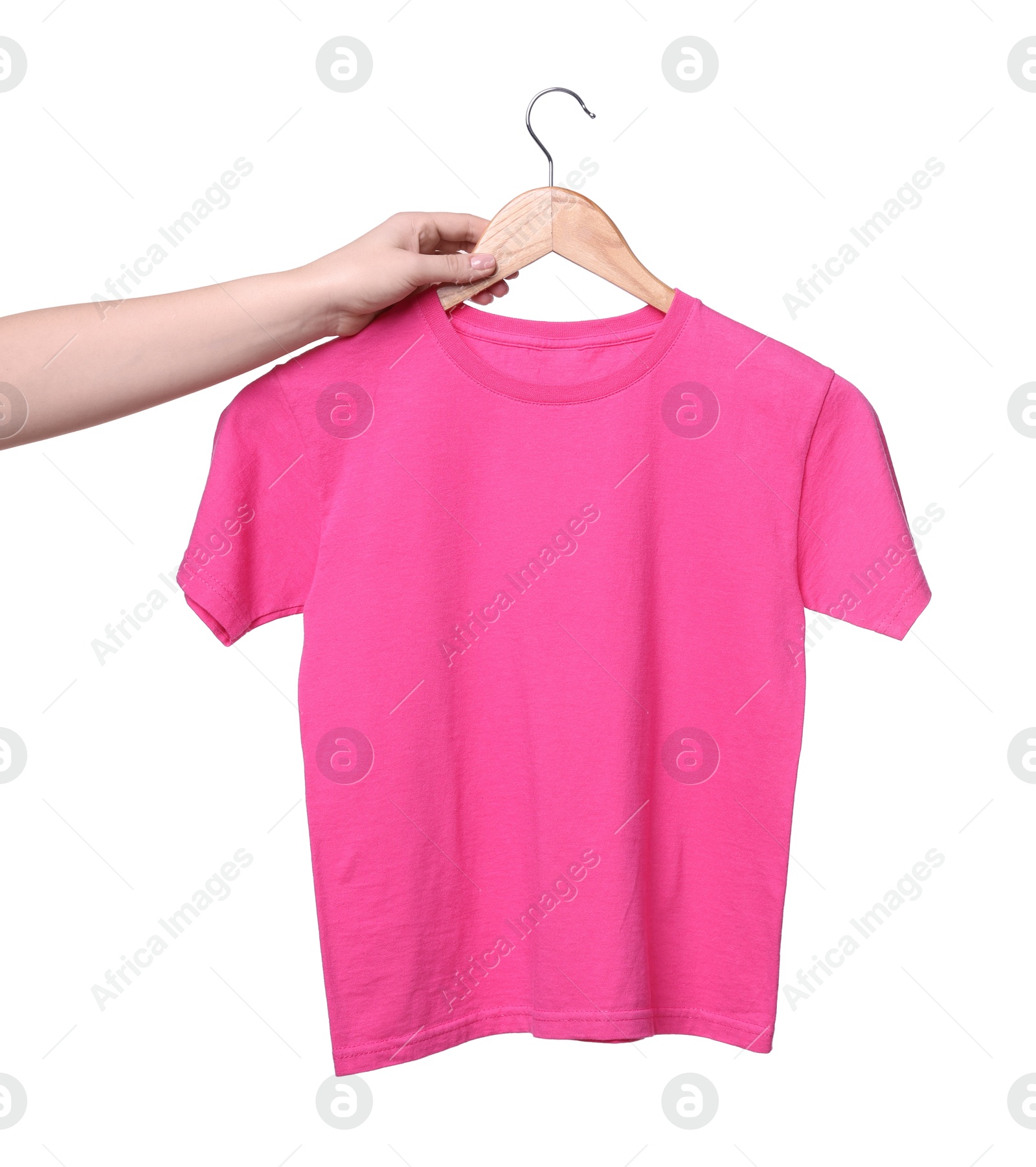 Photo of Woman holding hanger with pink t-shirt on white background, closeup