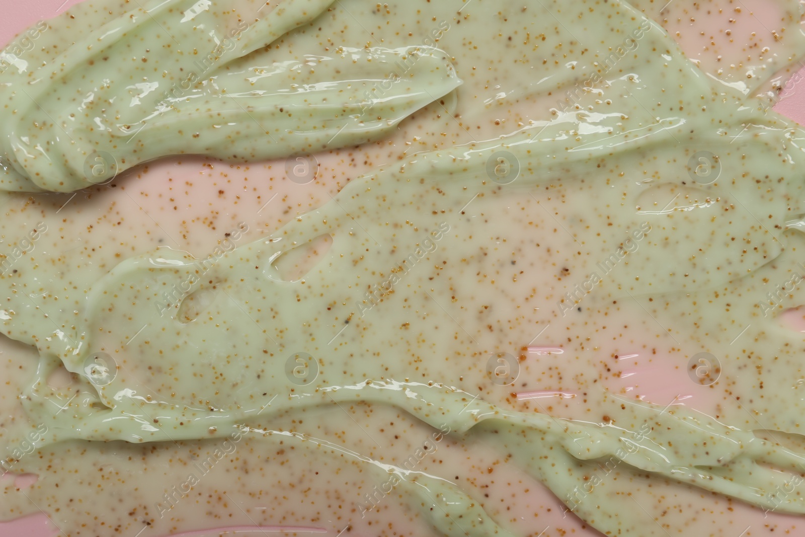 Photo of Sample of body scrub on pink background, top view