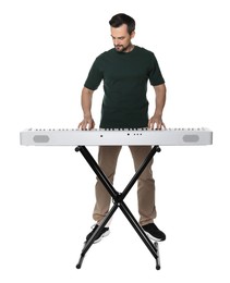 Photo of Bearded man playing synthesizer on white background